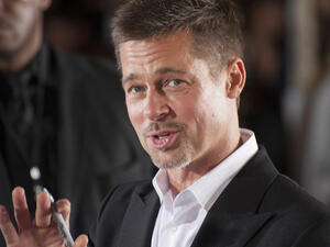 Actor and producer Brad Pitt bid $120,000 to watch an episode of Game of Thrones with Emilia Clarke, who plays Daenerys (Source: Ozgur Guvenc - Shutterstock)