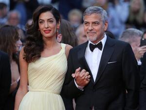 George and Amal Clooney, proud (and angry) parents. (David Silpa / UPI)