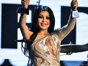 Haifa Wehbe showing-off some prizes. (FashionStock.com / Shutterstock.com)