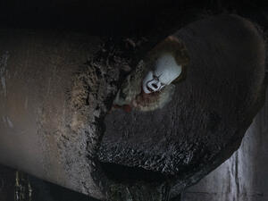 "Hey kid. Wanna buy a balloon?" (Warner Bros. Pictures)