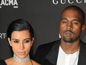 Kim Kardashian (seen here with husband Kanye West) isn't paying for a car accident she caused. (Featureflash Photo Agency / Shutterstock.com)