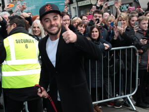 The 42-year-old presenter seemed in good spirits as he brandished his award in the air, before breaking down in tears as he left the stage. (Source: Twocoms - Shutterstock)