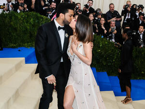 Selena Gomez and The Weeknd kiss. (Sky Cinema / Shutterstock.com)