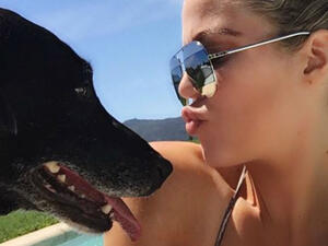 The 'Keeping Up With The Kardashians' star is "devastated" by the passing of her canine friend, a black Labrador called Gabbana (Source: @khloekardashian - Instagram)