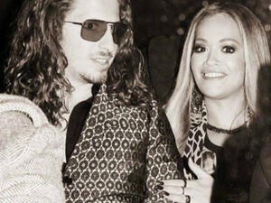 Earlier this week, Rita uploaded a black-and-white snapshot of herself posing with a hand affectionate on the rocker's arm at Monday night's glitzy event London. (Source: Instagram - @ritaora)