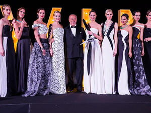 Fawaz Gruosi poses on the catwalk with models adorned with de GRISOGONO's latest DIVINE HIGH JEWELLERY CREATIONS.