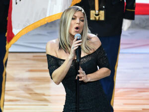 The 42-year-old singer performed the 'Star-Spangled Banner' at Los Angeles' Staples Center on Sunday (02.18.18)  (Source: ALLEN BEREZOVSKY / GETTY IMAGES NORTH AMERICA / AFP)