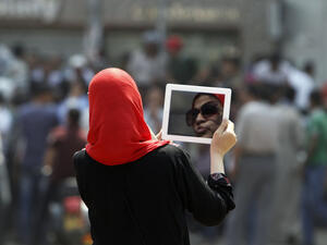 Photographer Roger Anis' photo essay "Closets of Dreams" sheds light on the clothes Egyptian women keep hidden in their closets out of fear of sexual harassment.  (AFP/File)