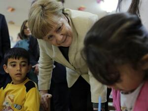 German Chancellor Angela Merkel talks with refugee children at a preschool, during a visit to a refugee camp on April 23, 2016 on the Turkish-Syrian border in Gaziantep. (AFP/Stringer) German Chancellor Angela Merkel talks with refugee children at a preschool, during a visit to a refugee camp on April 23, 2016 on the Turkish-Syrian border in Gaziantep. (AFP/Stringer)