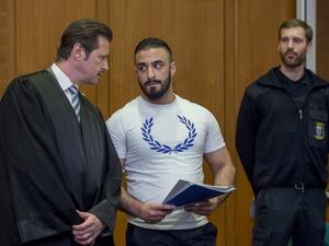 Defendant Aria L (C) talks with his lawyer Andreas Bensch as he waits for the opening of his trial at court in Frankfurt am Main, western Germany, on May 3, 2016.(AFP/Torsten Silz) Defendant Aria L (C) talks with his lawyer Andreas Bensch as he waits for the opening of his trial at court in Frankfurt am Main, western Germany, on May 3, 2016.(AFP/Torsten Silz)