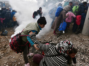 Refugees were sprayed with tear gas at the Macedonian border with Greece. (AFP/File) Refugees were sprayed with tear gas at the Macedonian border with Greece. (AFP/File)