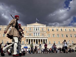 Greek soldiers march past a government building in Athens, Greece. (AFP/File)