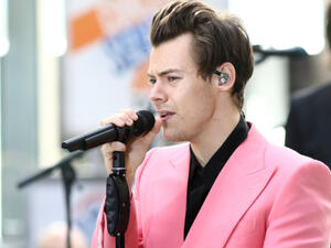 The former One Direction singer, 24, looked completely smitten with the baby as he gazed lovingly at it, giving a big smile as he enjoyed a walk in London this week. (Source: JStone - Shutterstock)