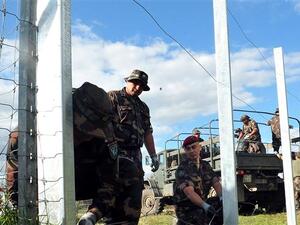 Hungarian soldiers erected a similar fence along the Croatian border in 2015. (AFP/File) Hungarian soldiers erected a similar fence along the Croatian border in 2015. (AFP/File)