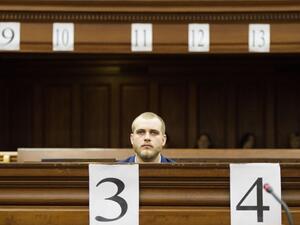 Henri van Breda sits in the dock at the Western Cape High Court to hear the verdict in his trial for allegedly killing his two parents, brother and maiming his sister with an axe in their luxury home, in Cape Town on May 21, 2018/AFP