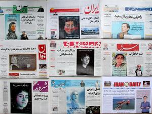 A picture taken in the capital Tehran on July 16, 2017 shows the front pages of Iranian newspapers bearing portraits of the top female scientist Maryam Mirzakhani (AFP)