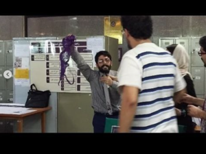 Conservative student in Iran university waves purple bra around in class in opposition of president Rouhani. 