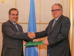 Syrian ambassador Hussam Edin Aala, left, with Vladimir Gratchev, representative of Secretary-General of the UN Conference (AFP/File Photo)