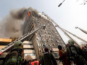 Firefighters battle a blaze that engulfed Iran's oldest high-rise, the 15-storey Plasco building in downtown Tehran on January 19, 2017. (AFP/Stringer)