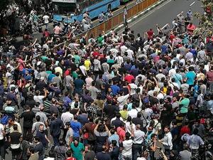 Iranian protesters shout slogans during a demonstration in central Tehran on June 25, 2018. (AFP)