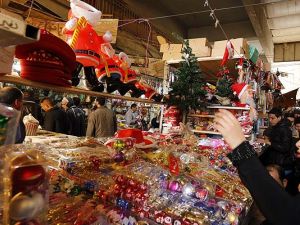 Iraqis shop for Christmas and New Year decorations and gifts at central Baghdad's Shorja market on December 20. (AFP/File)