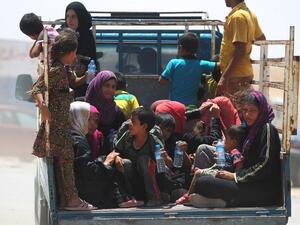 Iraqi women and children who fled the towns of al-Shirqat and Qayyarah during fighting between Iraqi government forces and Daesh, are transferred to a camp for displaced people on July 27, 2016. (AFP/Ahmad al-Rubaye) Iraqi women and children who fled the towns of al-Shirqat and Qayyarah during fighting between Iraqi government forces and Daesh, are transferred to a camp for displaced people on July 27, 2016. (AFP/Ahmad al-Rubaye)