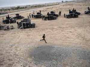 Members of the Iraqi Counter Terrorism Service (CTS) drive near the village of Bazwaya, on the eastern edges of Mosul, tightening the noose on Daesh as the offensive entered its third week on October 31, 2016. (AFP/Bulent Kilic)