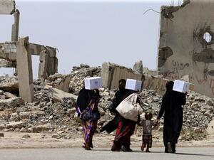 Mosul residents flee fighting earlier this year as government forces battled to retake the city from ISIS (AFP)