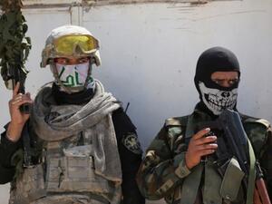 Shiite militiamen in Iraq have been accused of carrying out war crimes by Amnesty International (AFP)