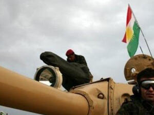 Iraqi Kurdish peshmerga forces in a tank flying the Kurdish flag north of Kirkuk on November 24, 2012 (AFP/Safin Hamed.)