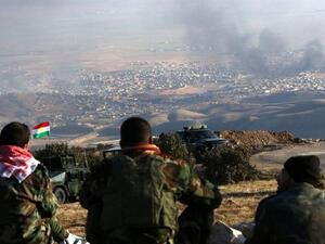 Kurdish peshmerga forces look out over Sinjar, Iraq. (AFP/File)