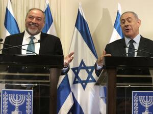 Israeli Prime Minister Benjamin Netanyahu and Avigdor Lieberman, the head of hardline nationalist party Yisrael Beitenu, are seen during a ceremony in which they signed a coalition agreement on May 25, 2016 at the Knesset. (AFP/Menahem Kahana)