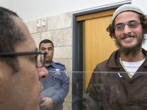 Meir Ettinger, the alleged head of a Jewish extremist group, at the Magistrate's Court in Nazareth Illit on August 4, 2015, a day after his arrest. (AFP/Jack Guez)