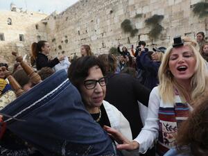 Israeli members of the liberal Jewish religious group Women of the Wall, carry a Torah scroll during prayers in the women's section of the Western Wall, in the Old city of Jerusalem on November 2, 2016. (AFP/Menahem Kahana)