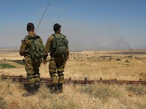Israeli soldiers patrol near the border with Syria after projectiles fired from the war-torn country hit Israel's Golan Heights on June 24, 2017. (AFP/Jalaa Marey)