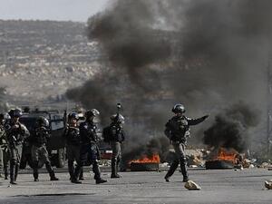 Israeli forces take position during clashes with Palestinian protesters in the West Bank village of Betunia near Ramallah on December 7, 2017. (AFP/ File Photo)
