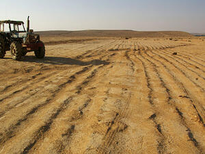 The uphill battle of growing food in the desert. A tractor stands abandoned in Israel's Negev desert. (Wikimedia Commons)