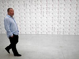 Chinese artist Ai Weiwei walks at the Israel Museum in Jerusalem on the eve of the opening of his new exhibition "Maybe, Maybe Not" at the Israel Museum in Jerusalem on June 1, 2017. (AFP/Thomas Coex)