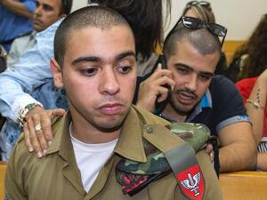 A spokesperson told the crowd that the family would, with the help of the Palestinian leadership, continue to push for a murder charge against Azaria in international courts. (AFP/File)