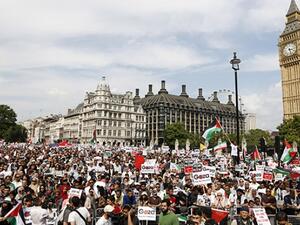 Demonstrators gather outside the Houses of Parliament after marching from outside the Israeli embassy in central London on July 26, 2014, calling for an end to violence in Gaza. (AFP/Justin Tallis)