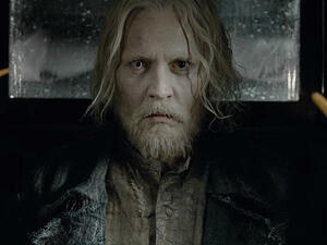 Unrecognisable: The sequel follows the Dark wizard Gellert Grindelwald - played by a grizzled Johnny Depp - escaping from the Magical Congress of the United States of America (Source: Warner Bros.)