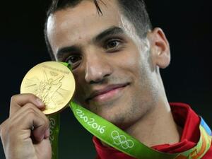 Ahmad Abu Ghaush poses with his gold medal, the first Olympic medal for Jordan. (AFP/File)