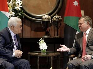 Jordan's King Abdullah II (R) talks with Palestinian Authority President Mahmoud Abbas before a meeting at the Royal Palace in Amman. (AFP/ File)