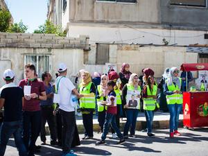 Young Jordanians hand out campaign fliers outside a polling station on Election Day in Amman, Jordan, on Sept. 20, 2016. (Lindsey Leger)