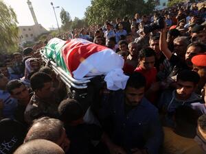 Jordanian soldiers carry the coffin of their comrade Belal Al-Zuhbi during his funeral in Nahleh village, near the city of Jerash north of Amman, on June 21, 2016, after he was killed alongside five other comrades in a suicide bomb attack on the border with Syria. (AFP/Stringer) Jordanian soldiers carry the coffin of their comrade Belal Al-Zuhbi during his funeral in Nahleh village, near the city of Jerash north of Amman, on June 21, 2016, after he was killed alongside five other comrades in a suicide bomb attack on the border with Syria. (AFP/Stringer)