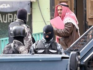 Jordanian security forces stand guard near the Crusader castle on December 19, 2016 in Karak, around 70 miles south of Amman, a day after an attack killed 10 people, including a Canadian tourist. (AFP/Khalil Mazraawi)