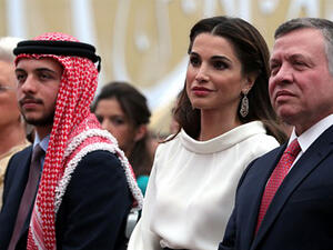 King Abdullah II (R) and Queen Rania (C) of Jordan sit near Crown Prince Hussein (2nd L) and King Abdullah's mother Princess Mona (L) during the ceremony. (AFP)