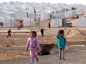 Young Syrian refugees stand around at the Azraq refugee camp in northern Jordan. (Khalil Mazraawi/AFP)