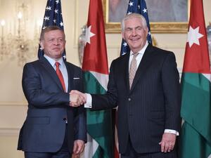 US Secretary of State Rex Tillerson (R) poses for a photo with Jordan's King Abdullah II ahead of a working lunch at the State Department in Washington, DC on April 4, 2017. (AFP/Mandel Ngan)
