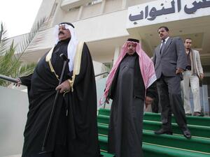 Jordanian MPs leave the parliament building in Amman. (Khalil Mazraawi / AFP Photo)